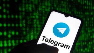 In this photo illustration the Telegram logo seen displayed