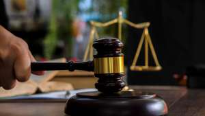 Law and justice concept. Judge's gavel, scales, hourglass, books.