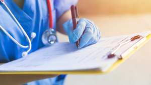 Doctor nurse followup data with medical examination document for patient health check in hospital or clinic.