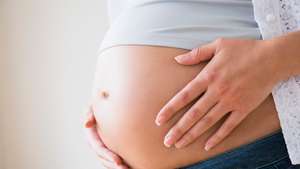 Close-up of pregnant woman's belly