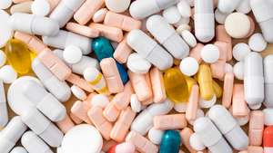 Full frame heap of various colors pills and capsules, close-up