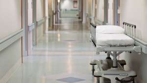 Portable hospital bed in hallway