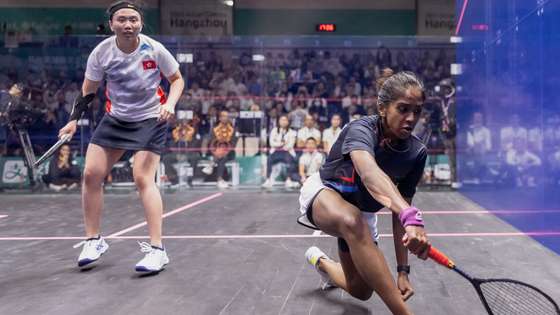 epa10901484 Sivasangari Subramaniam (blue) of Malaysia reacts after winning the women’s singles final squash match against Sin Yuk Chan (white) of Hong Kong, at the 19th Asian Games Hangzhou 2022, Hangzhou, China, 05 October 2023.  EPA/ALEX PLAVEVSKI
