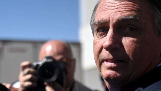 epa10704195 Former president of Brazil, Jair Bolsonaro, leaves the Federal Senate after visiting his son Senator Flavio Bolsonaro at the National Congress in Brasilia, Brazil 21 June 2023. The Superior Electoral Court (TSE) will begin a trial on 22 June for alleged abuses of power by former Brazilian President Jair Bolsonaro, who may lose all his political rights if found guilty.  EPA/Andre Borges