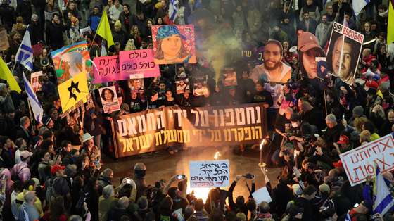 epa11806127 Families of hostages held by Hamas in Gaza and their supporters light a bonfire and flares as they attend a protest calling for a ceasefire and the release of hostages, near the Kirya military base in Tel Aviv, Israel, 04 January 2025. According to the Israeli army (IDF) spokesperson, around 100 Israeli hostages remain in captivity in the Gaza Strip, including bodies of 33 confirmed dead.  EPA/ABIR SULTAN