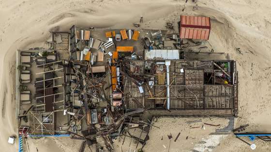epa12704860 An aerial view shows buildings damaged by Storm Kristin in Praia da Vieira, in Marinha Grande municipality, Portugal, 04 February 2026. The Portuguese government has declared a state of disaster for many municipalities in the Leiria and Coimbra districts, struck by Storm Kristin in late January 2026. As of 04 February 2026, parts of the region are under orange and yellow alerts due to Storm Leonardo.  EPA/PEDRO CASTANHEIRA E CUNHA