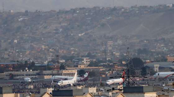 epa09416577 A view of Hamid Karzai International Airport after Taliban took control of Kabul, Afghanistan, 16 August 2021. Several people were reportedly killed at Kabul airport on 16 August as Afghans were attempting to hang on a moving US military plane leaving the airport. Taliban co-founder Abdul Ghani Baradar earlier in the day declared victory and an end to the decades-long war in Afghanistan, a day after the insurgents entered Kabul to take control of the country. Baradar, who heads the Taliban political office in Qatar, released a short video message after President Ashraf Ghani fled and conceded that the insurgents had won the 20-year war.  EPA/STRINGER