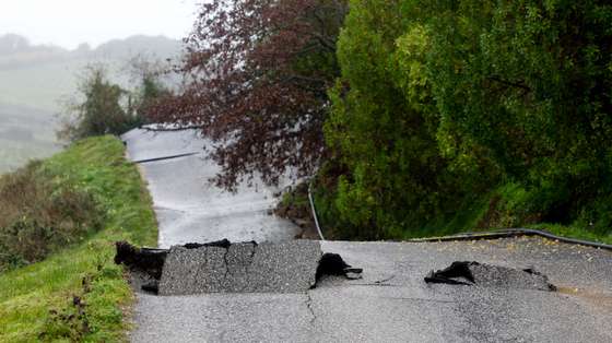 epa12724058 The Lapao Road, which was damaged by severe weather, in Arruda dos Vinhos, Alenquer, Portugal, 10 February 2026. Successive storms, Kristin, Leonardo, and Marta, have resulted in at least 15 deaths in Portugal since 28 January 2026, and left many others injured and homeless.  EPA/ANTONIO PEDRO SANTOS