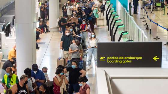 Passengers wait hours in long lines for their flight due to a strike of the handling company, Groundforce, which is causing major disruption in the Lisbon Airport, causing the cancelation of dozens of flights, in Lisbon, Portugal, 17 July 2021. Groundforce workers are protesting against colective dismissal of workers and low salaries. JOSE SENA GOULAO/LUSA