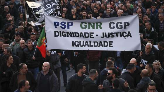 Police officers hold a banner with the words "Dignity, Justice, Equality" protest during a demonstration by the platform of PSP (Public Security Police) unions and GNR (National Republican Guard) associations for the restructuring of pay supplements and for the enhancement and dignification of professionals, Porto, Portugal, 31 January 2024.  ESTELA SILVA/LUSA