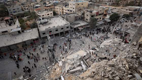 epa11208497 Palestinians inspect the area after an Israeli airstrike  hit Al Masry Tower in the Rafah refugee camp,  the southern Gaza Strip, 09 March 2024. More than 30,800 Palestinians and over 1,300 Israelis have been killed, according to the Palestinian Health Ministry and the Israel Defense Forces (IDF), since Hamas militants launched an attack against Israel from the Gaza Strip on 07 October 2023, and the Israeli operations in Gaza and the West Bank which followed it.  EPA/HAITHAM IMAD