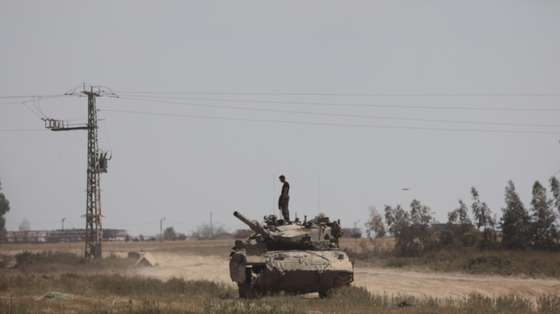 epa11263792 An Israeli soldier on a tank near the border to the Gaza Strip, in southern Israel, 07 April 2024. Israel marks six months since the October 07 attacks, as 134 hostages are currently still being held captive in Gaza, according to the Israeli IDF. More than 33,000 Palestinians and over 1,450 Israelis have been killed, according to the Palestinian Health Ministry and the Israel Defense Forces (IDF), since Hamas militants launched an attack against Israel from the Gaza Strip on 07 October 2023, and the Israeli operations in Gaza and the West Bank which followed it.  EPA/ABIR SULTAN  EPA-EFE/ABIR SULTAN