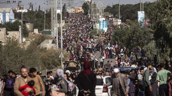 epa10968544 Palestinians evacuating to the southern Gaza Strip, make their way along Salah al-Din Street in Bureij, 10 November 2023. More than 10,700 Palestinians and at least 1,400 Israelis have been killed, according to the Israel Defense Forces (IDF) and the Palestinian health authority, since Hamas militants launched an attack against Israel from the Gaza Strip on 07 October, and the Israeli operations in Gaza and the West Bank which followed it.  EPA/HAITHAM IMAD