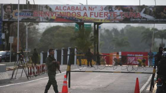 epa12622968 An armed officer mans a checkpoint near Fuerte Tiuna (Fort Tiuna), which houses the headquarters of Venezuelan Ministry of Defense, in Caracas, Venezuela, 03 January 2026, after multiple explosions were reported across the capital. US President Trump announced that a 'large-scale strike' on Caracas resulted in the capture of Venezuelan leader Nicolas Maduro and his wife, who were reportedly flown out of the country. The Venezuelan government denounced the US operation as a 'grave military aggression'.  EPA/MIGUEL GUTIERREZ