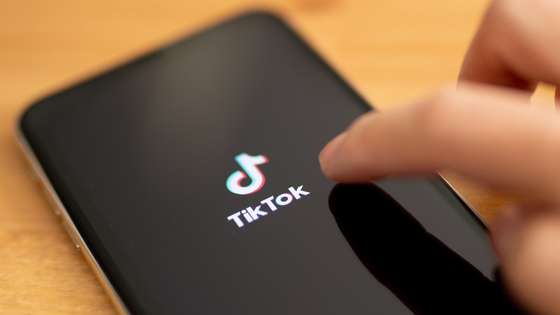 epa08678602 (FILE) - A close-up shows the video-sharing application 'TikTok' on a smart phone in Berlin, Germany, 07 July 2020 (reissued 18 September 2020). The US Commerce Department on 18 September 2020 announced that downloads of ByteDance's video sharing app TikTok and multi-purpose messaging and payment platform WeChat will be blocked in the US starting 20 September 2020.  EPA/HAYOUNG JEON