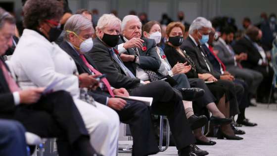 epa09557560 Britain's Prime Minister Boris Johnson (4-L) sits next to British broadcaster and naturalist Sir David Attenborough (5-L) during the opening ceremony of the UN Climate Change Conference (COP26) in Glasgow, Britain 01 November 2021. The COP26 climate change conference runs from 31 October to 12 November 2021 in Glasgow.  EPA/ROBERT PERRY