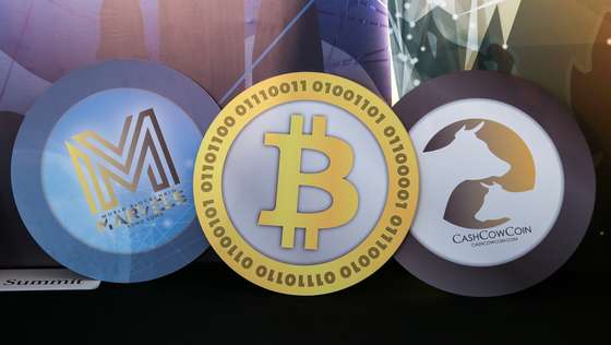 epa09485704 (FILE) - Logos of (L-R) the World Blockchain Marvels, and cryptocurrencies Bitcoin, and CashCowCoin are displayed during the World Blockchain Marvels in Hong Kong, China, 24 August 2018 (reissued 24 September 2021). China's People's Bank on 24 September 2021 in a statement said that "Virtual currency-related business activities are illegal financial activities."  EPA/JEROME FAVRE *** Local Caption *** 54572171