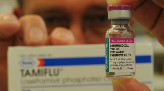 Reading Hospital Pharmacy Superviser James Smith Jr. holds a dose of Pneumococcal Vaccine, or  "Pneumovax", a back-up medication for a flu vaccine such as Tamiflu, background.  Photo by Bill Uhrich  8/6/2009