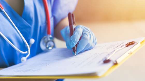 Doctor nurse followup data with medical examination document for patient health check in hospital or clinic.