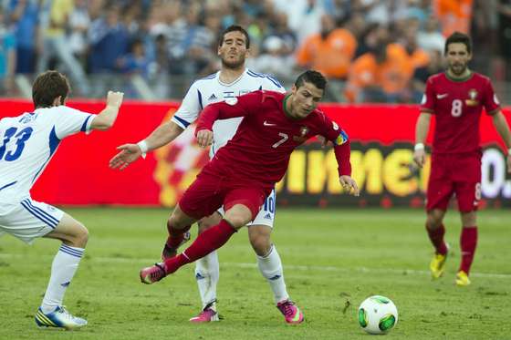 Israeli midfielder Gal alberman (back) is challenged by Portuguese forward Cristiano Ronaldo (front) during the FIFA 2014 World Cup European zone qualifying group F match between Israel and Portugal at Ramat Gan Stadium, near Tel Aviv, on March 22, 2013. AFP PHOTO / JACK GUEZ (Photo credit should read JACK GUEZ/AFP/Getty Images)