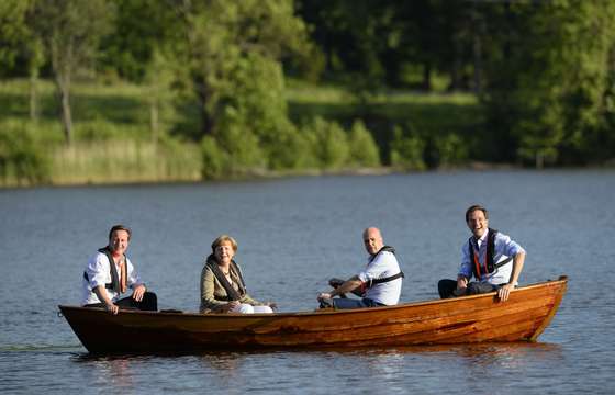 (L to R) British Prime Minister David Cameron, German Chancellor Angela Merkel, Swedish Prime minister Fredrik Reinfeldt and Dutch Prime Minister Mark Rutte talk in a boat near the summer residence of the Swedish Prime Minister in Harpsund 120km west of Stockholm on June 9, 2014. The Swedish Prime Minister will host German Chancellor Angela Merkel, British Prime Minister David Cameron and Dutch Prime Minister Mark Rutte for talks on the EU and the new European Parliament on June 9 to 10, 2014. AFP PHOTO / JONATHAN NACKSTRAND        (Photo credit should read JONATHAN NACKSTRAND/AFP/Getty Images)