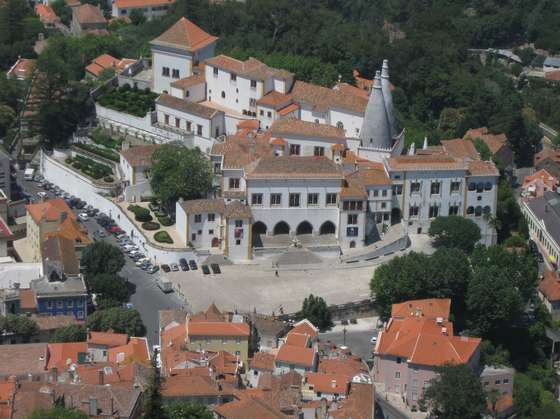 SINTRA, PORTUGAL - JULY 26:  A view of Sintra National Palace, also called the Royal Palace, as seen from the Moorish Castle on July 26, 2008 in Sintra, Portugal. Portugal is becoming an increasingly popular tourist destination.  (Photo by Sean Gallup/Getty Images)