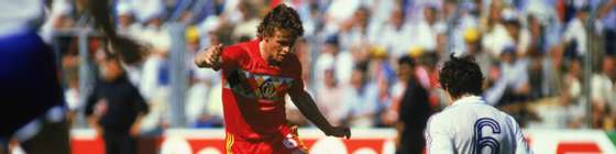 NANTES - JUNE 16:  Frank Vercauteren of Belgium is tackled by Luis Fernandez of France during the UEFA European Championships 1984 Group A match between Belgium and France held on June 16, 1984 at La Beaujoire, in Nantes, France. France won the match 5-0. (Photo by Trevor Jones/Getty Images)