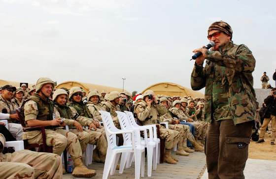 BAGHDAD, IRAQ - DECEMBER 16:  Actor/comedian Robin Williams entertains the troops during the United Service Organizations (USO) tour at Baghdad International Airport on December 16, 2003.  (Photo by Lisa M. Zunzanyika/U.S. Air Force via Getty Images)