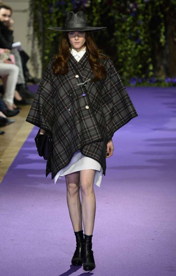 A model presents a creation by Alexis Mabille during the 2014/2015 Autumn/Winter ready-to-wear collection fashion show, on February 26, 2014 in Paris.  AFP PHOTO / BERTRAND GUAY        (Photo credit should read BERTRAND GUAY/AFP/Getty Images)