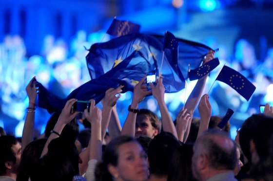 Croatians wave an EU flag as they celebrate the accession of Croatia to the European Union at Ban Jelesic square in Zagreb on June 30, 2013. Tens of thousands of Croatians cheered the country's entry into the European Union at midnight Sunday (2200 GMT), almost two decades after the former Yugoslav republic's bloody independence war ended.  AFP PHOTO / STRINGER        (Photo credit should read STR/AFP/Getty Images)