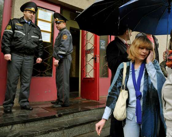 Belarus opposition leader Andrei Sannikov 's wife, Irina Khalip (R), speaks on her mobile phone reporters shortly after her release, outside the court in Minsk on May 16, 2011. Belarus on Monday handed a two year suspended prison sentence to  journalist Irina Khalip, who was arrested during post-election protests in Minsk and risked losing her son to child protection authorities, two days after the jailing of her husband sparked a global outcry. AFP PHOTO/ VIKTOR DRACHEV (Photo credit should read VIKTOR DRACHEV/AFP/Getty Images)