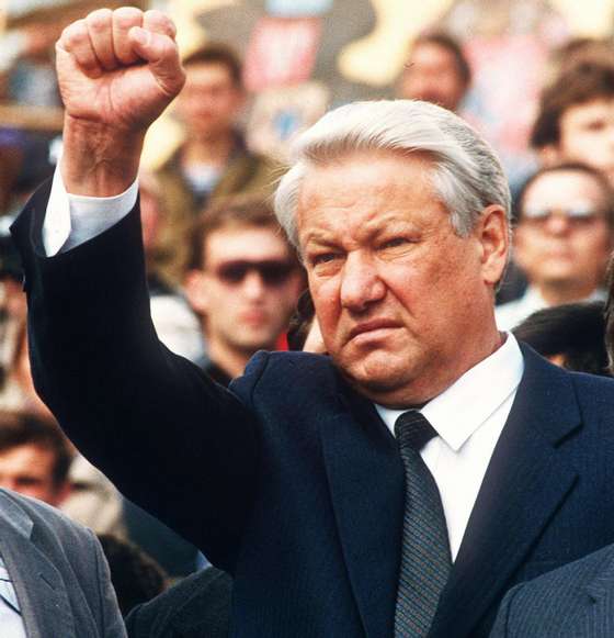 TO GO WITH AFP STORY BY ANNA SMOLCHENKO (FILES) A file photo taken on August 24 1991 of Russian President Boris Yeltsin clenching a fist during the funeral of 3 young men killed during the coup attempt of mid-Augustin Moscow,.Russia this week marks the 80th anniversary of the birth of former president Boris Yeltsin, praised by some for his courage in steering the country towards democracy and best remembered by others for his drunken antics. AFP PHOTO / ANDRE DURAND (Photo credit should read ANDRE DURAND/AFP/Getty Images)