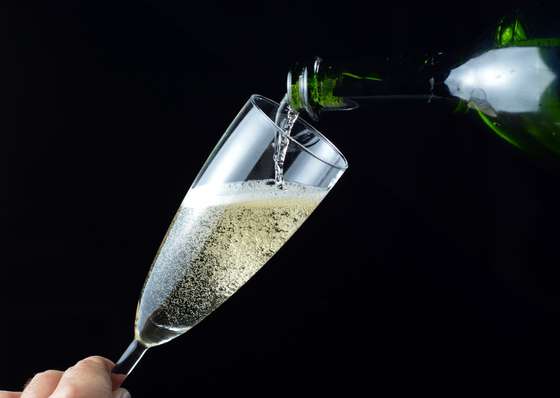 A picture taken on December 31, 2012 in Paris shows a glass being filled up with champagne ahead of the New Year celebrations. AFP PHOTO MIGUEL MEDINA        (Photo credit should read MIGUEL MEDINA/AFP/Getty Images)