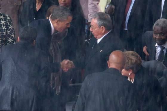 JOHANNESBURG, SOUTH AFRICA - DECEMBER 10:  U.S. President Barack Obama (L) shakes hands with Cuban President Raul Castro during the official memorial service for former South African President Nelson Mandela at FNB Stadium December 10, 2013 in Johannesburg, South Africa. Over 60 heads of state have travelled to South Africa to attend a week of events commemorating the life of former South African President Nelson Mandela. Mr Mandela passed away on the evening of December 5, 2013 at his home in Houghton at the age of 95. Mandela became South Africa's first black president in 1994 after spending 27 years in jail for his activism against apartheid in a racially-divided South Africa.  (Photo by Chip Somodevilla/Getty Images)