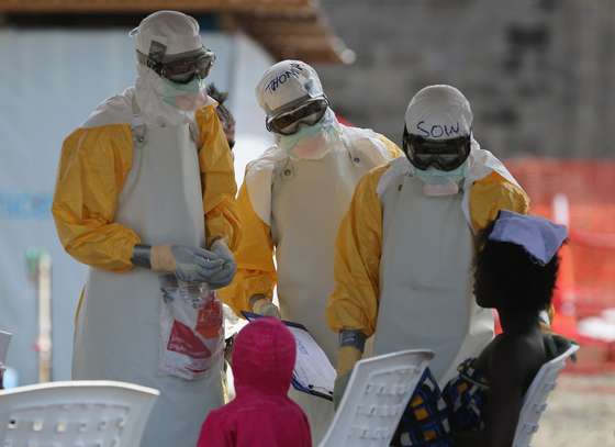 PAYNESVILLE, LIBERIA - OCTOBER 16:  Health workers at Doctors Without Borders (MSF), talk with Ebola patients in the high-risk area of the ELWA 3 Ebola treatment center on October 16, 2014 in Paynesville, Liberia. The World Health Organization says that more than 4,500 people have died due to the Ebola epidemic in West Africa with a mortality rate for the disease at about 70 percent. (Photo by John Moore/Getty Images)