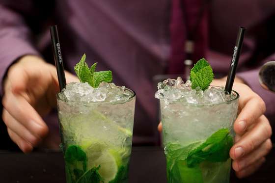 MADRID, SPAIN - APRIL 09: A bartender serves two Mojito cocktails during the Mix&Shake congress at 'El Matadero' on April 9, 2014 in Madrid, Spain. Mix&Shake is a conference for professionals of the cocktail bartending industry. (Photo by Pablo Blazquez Dominguez/Getty Images)