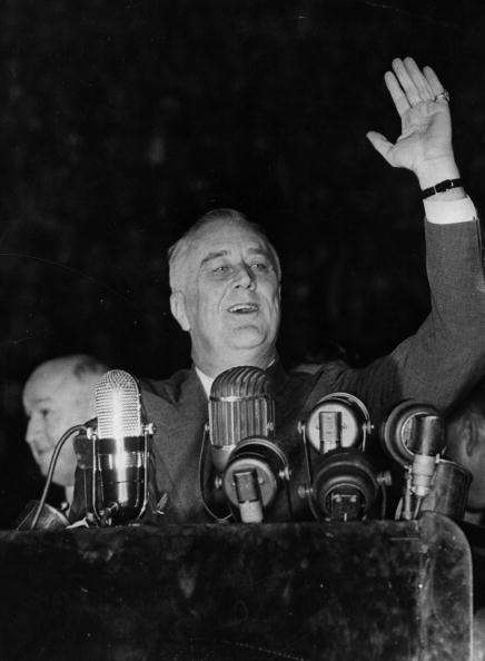 8th November 1940:  American President Franklin Delano Roosevelt (1882 - 1945) speaking to a crowd of 25,000 at Madison Square Gardens, New York, before his sweeping re-election for a third term.  (Photo by Fox Photos/Getty Images)