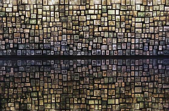 BREZEZINKA, POLAND - DECEMBER 10: Photographs are displayed at the Birkenau Museum, December 10, 2004 of the many faces of the men, women and children at the Auschwitz II - Birkenau which was built in March 1942 in the village of Brzezinka, Poland. The camp was liberated by the Soviet army on January 27, 1945, January 2005 will be the 60th anniversary of the liberation of the extermination and concentration camps, when survivors and victims who suffered as a result of the Holocaust will commemorated across the world. (Photo by Scott Barbour/Getty Images)