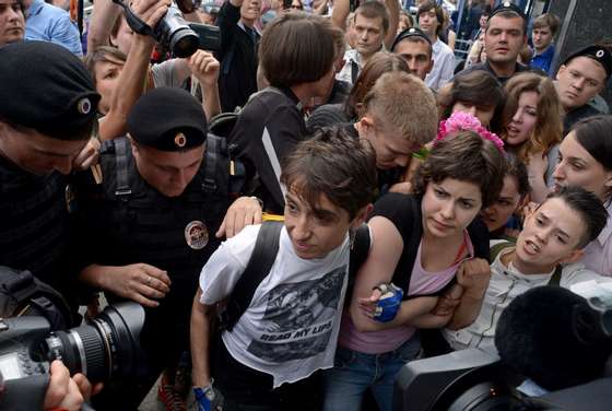 Masha Gessen (L) and other Russian gay rights activists protest outside the lower house of Russias parliament, the State Duma, in Moscow, on June 11, 2013. Russia's parliament debated today a law introducing steep fines and jail terms for people who promote homosexual "propaganda" to minors, a measure critics fear will be used to justify the repression of gays amid rising homophobia in the country. AFP PHOTO / KIRILL KUDRYAVTSEV        (Photo credit should read KIRILL KUDRYAVTSEV/AFP/Getty Images)