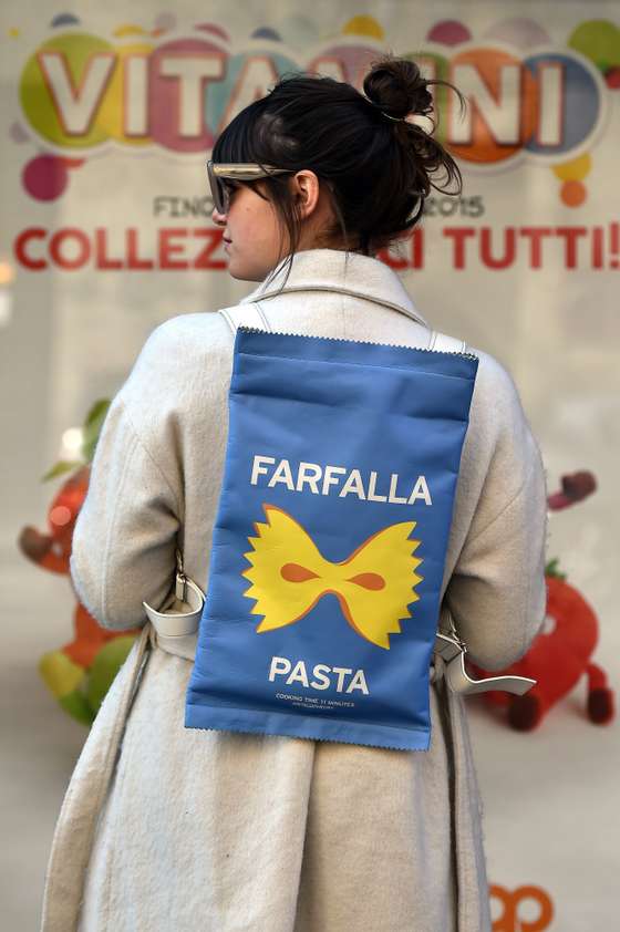 A woman poses in the street before the show for fashion house Dolce & Gabbana at the women Fall / Winter 2015/16 Milan's Fashion Week on March 1, 2015.  AFP PHOTO / GABRIEL BOUYS        (Photo credit should read GABRIEL BOUYS/AFP/Getty Images)