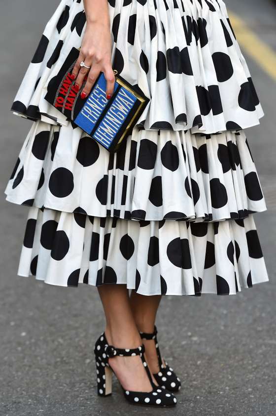 Model Lise Grendene poses in the street before the show for fashion house Dolce & Gabbana at the women Fall / Winter 2015/16 Milan's Fashion Week on March 1, 2015.  AFP PHOTO / GABRIEL BOUYS        (Photo credit should read GABRIEL BOUYS/AFP/Getty Images)