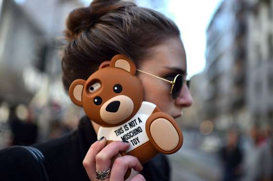 A woman speaks on the phone before the Dolce & Gabbana fashion show during the women Fall / Winter 2015/16 Milan's Fashion Week on March 1, 2015.  AFP PHOTO / GABRIEL BOUYS        (Photo credit should read GABRIEL BOUYS/AFP/Getty Images)