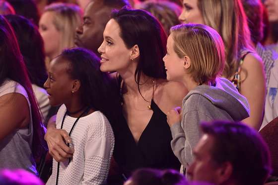 INGLEWOOD, CA - MARCH 28: Actress Angelina Jolie hugs Zahara Marley Jolie-Pitt (L) and Shiloh Nouvel Jolie-Pitt (R) after winning award for Favorite Villain in 'Maleficent' during Nickelodeon's 28th Annual Kids' Choice Awards held at The Forum on March 28, 2015 in Inglewood, California. (Photo by Kevin Winter/Getty Images)