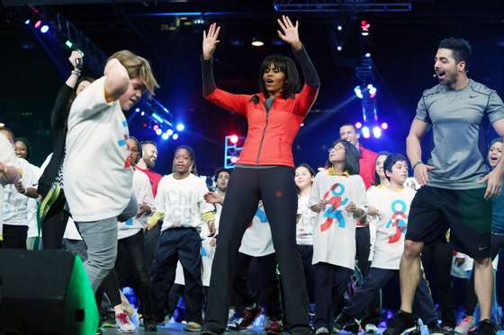 CHICAGO,IL - FEBRUARY 28:  First lady Michelle Obama (3rd L) dances with school children during a debut of a school exercise program February 28, 2013 in Chicago, Illinois. Obama unveiled a new initiative called "Let's Move Active Schools" to help schools create a physical activity programs for students.  (Photo by Tasos Katopodis/Getty Images)