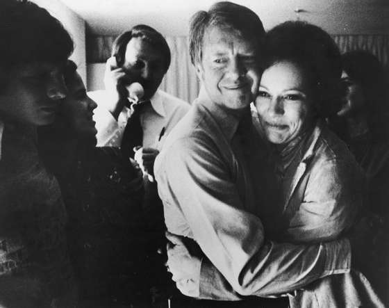 Democratic presidential candidate Jimmy Carter embraces his wife Rosalynn after receiving the final news of his victory in the national general election, November 2, 1976. (Photo by Hulton Archive/Getty Images)