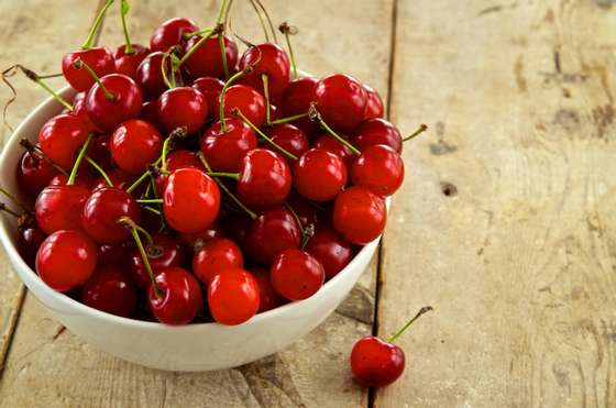 UNSPECIFIED LOCATION - UNSPECIFIED DATE:  In this handout photo provided by the Cherry Marketing Institute, Fresh Tart Cherries on Wooden Plank.  (Photo by Tom Enos/Cherry Marketing Institute via Getty Images)