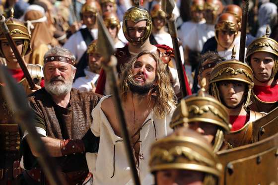 Actors perform the Passion of Christ during Good Friday, in Castro Urdiales, province of Cantabria in northern Spain on April 18, 2014. Living Passion is a representation of the Passion of Christ from the last supper to his crucifixion, death and resurrection.   AFP PHOTO/ CESAR MANSO        (Photo credit should read CESAR MANSO/AFP/Getty Images)