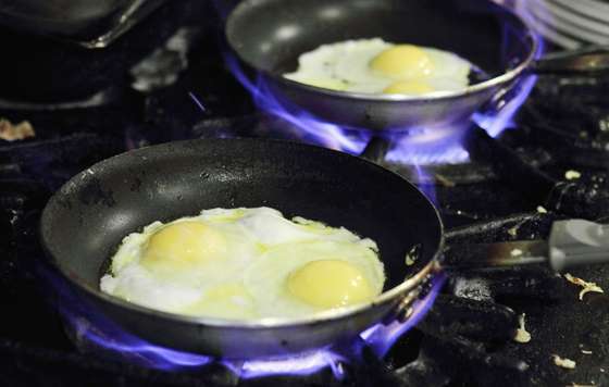 SAN RAFAEL, CA - AUGUST 26: Eggs cook in pans at Lundy's Home Cooking on August 26, 2010 in San Rafael, California. Egg prices have skyrocketed nearly 40 percent since two Iowa egg farms have recalled more than a half billion eggs that are believed to have sickened 1,300 people with Salmomella poisining in several states.  (Photo by Justin Sullivan/Getty Images)
