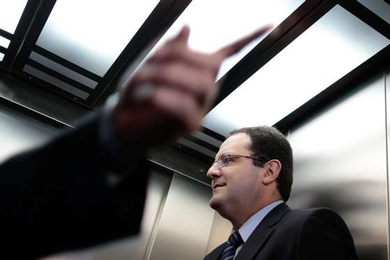 Brazilian Planning Minister Nelson Barbosa depicted in a lift after a meeting with Brazilian President Dilma Rousseff at Planalto Palace in Brasilia on January 28, 2015. AFP PHOTO / Wenderson Araujo        (Photo credit should read WENDERSON ARAUJO/AFP/Getty Images)