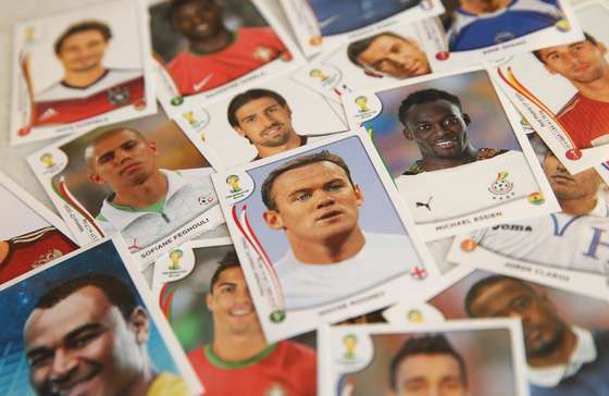 RIO DE JANEIRO, BRAZIL - MAY 28:  Panini World Cup stickers are displayed, including one of England star Wayne Rooney (C), on May 28, 2014 in Rio de Janeiro, Brazil. Fans of World Cup Soccer are flocking to buy the stickers which are placed in an album where the fans of World Cup Soccer try to fill their books with all 640 stickers, which include each player for the 32 nations in the tournament plus a team picture, logo and photos of the stadiums. The 2014 FIFA World Cup begins June 12 in Brazil.  (Photo Illustration by Mario Tama/Getty Images)